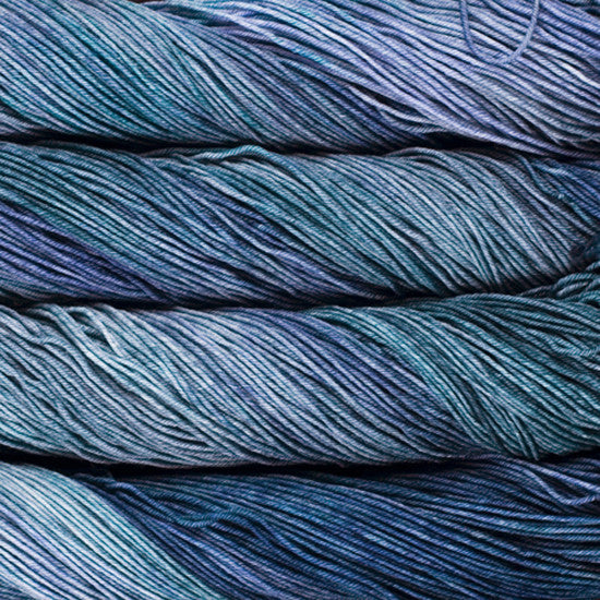 An image of skeins of Malabrigo Arroyo sport weight yarn in sky blue, navy, and light purple shades.