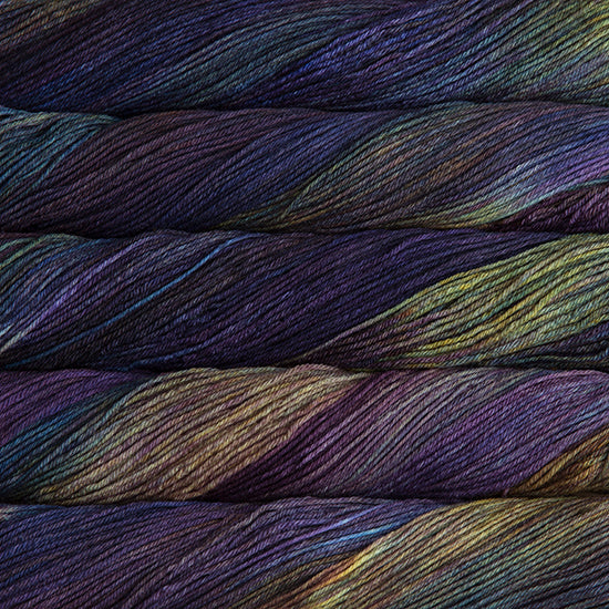 An image of skeins of Malabrigo Arroyo sport weight yarn in deep purple, blue, and yellow green shades.