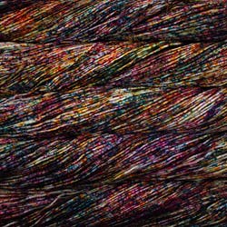 An image of skeins of Malabrigo Arroyo sport weight yarn in an off-white base with speckles of orange, pink, purple, and teal..