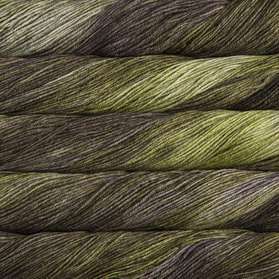 An image of skeins of Malabrigo Arroyo sport weight yarn in muted green and brown shades.