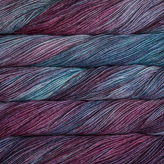 An image of skeins of Malabrigo Arroyo sport weight yarn in deep purple and sky blue shades.