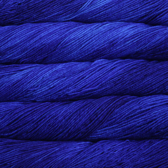An image of skeins of Malabrigo Arroyo sport weight yarn in shades of electric blue.