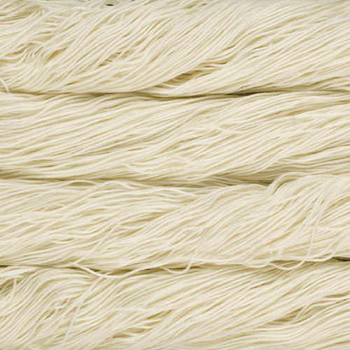 An image of skeins of Malabrigo Arroyo sport weight yarn in a solid off-white color.