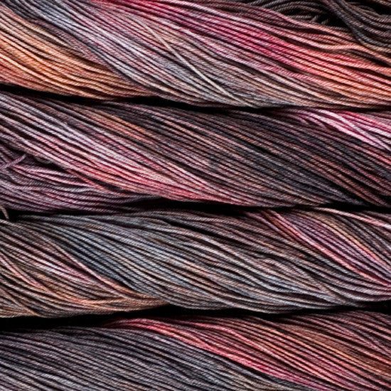 An image of skeins of Malabrigo Arroyo sport weight yarn in light pink, brown, and charcoal shades.