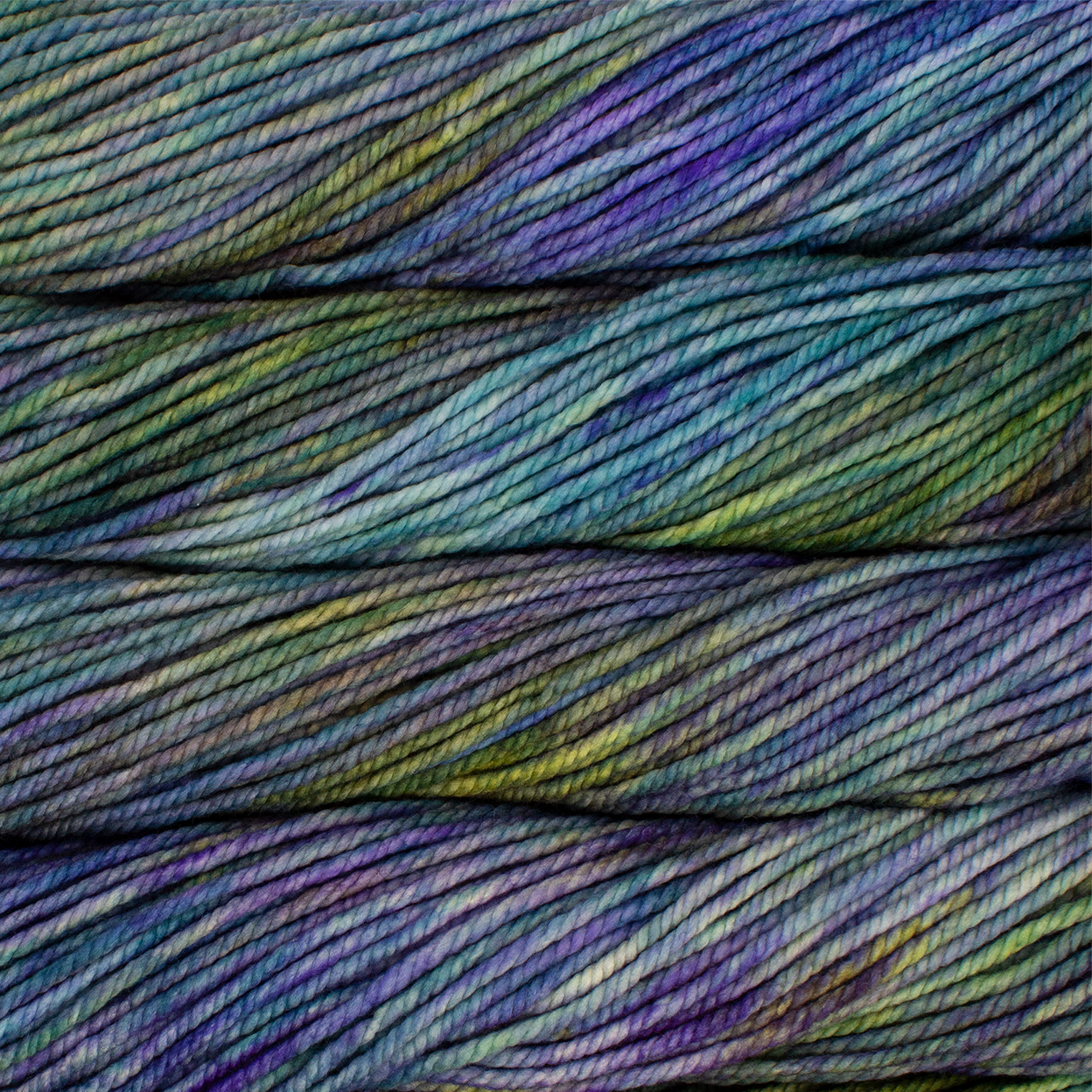 A close up image of skeins of Malabrigo Chunky bulky weight yarn in shades of blue, green, and purple.