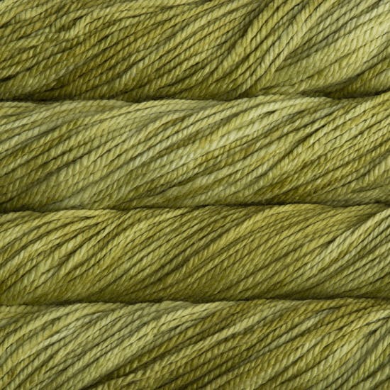 A close up image of skeins of Malabrigo Chunky bulky weight yarn in light green shades.
