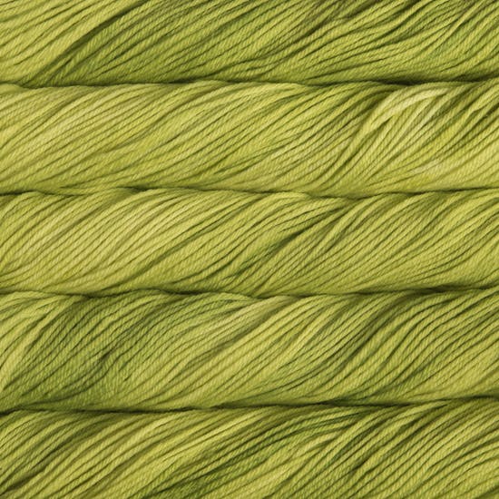 A close up of skeins of Malabrigo Rios worsted weight yarn in yellow green color
