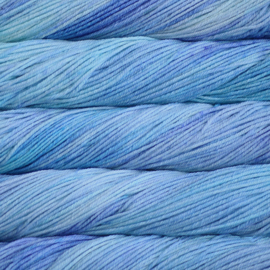 A close up of skeins of Malabrigo Rios worsted weight yarn in pale blue colors