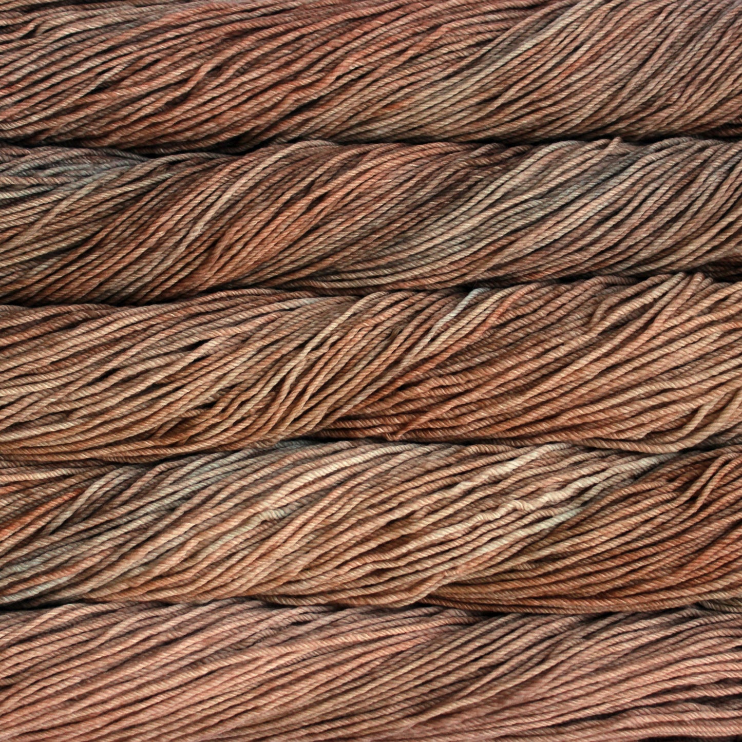 A close up of skeins of Malabrigo Rios worsted weight yarn in tan and beige colors