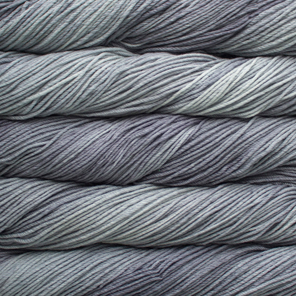 A close up of skeins of Malabrigo Rios worsted weight yarn in gray color