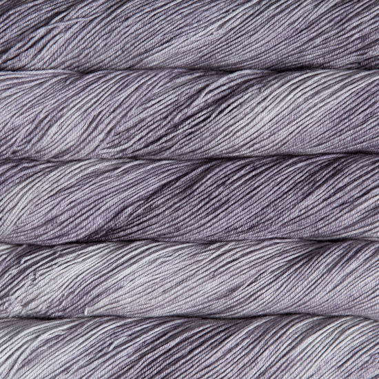 A close-up image of skeins of Malabrigo Sock yarn in pale purple.