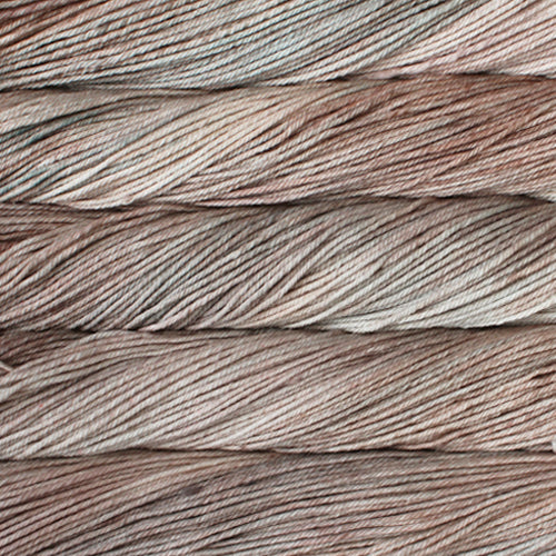 A close up of skeins of Malabrigo Rios worsted weight yarn in light beige colors