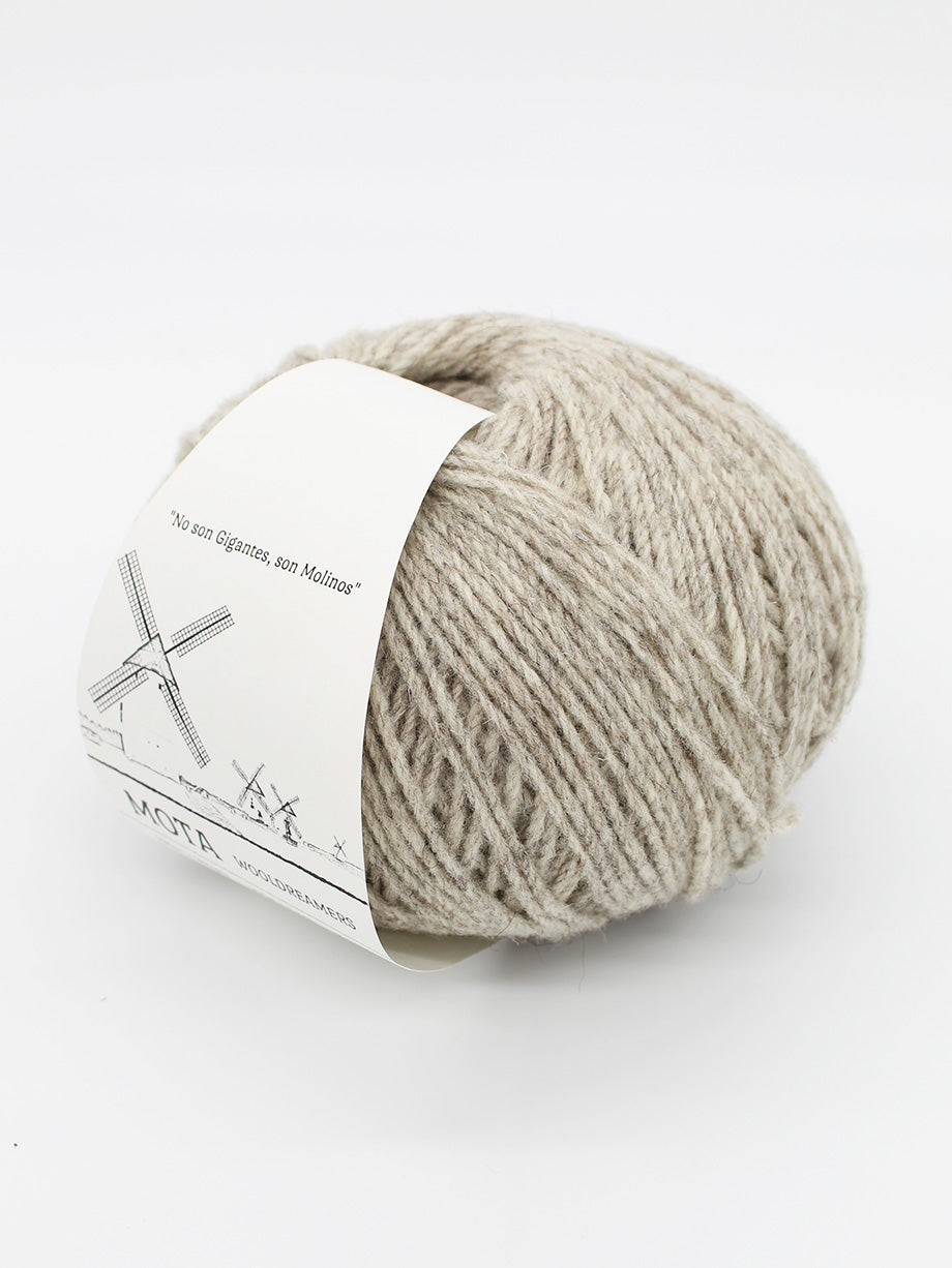 A skein of light beige on a white background.