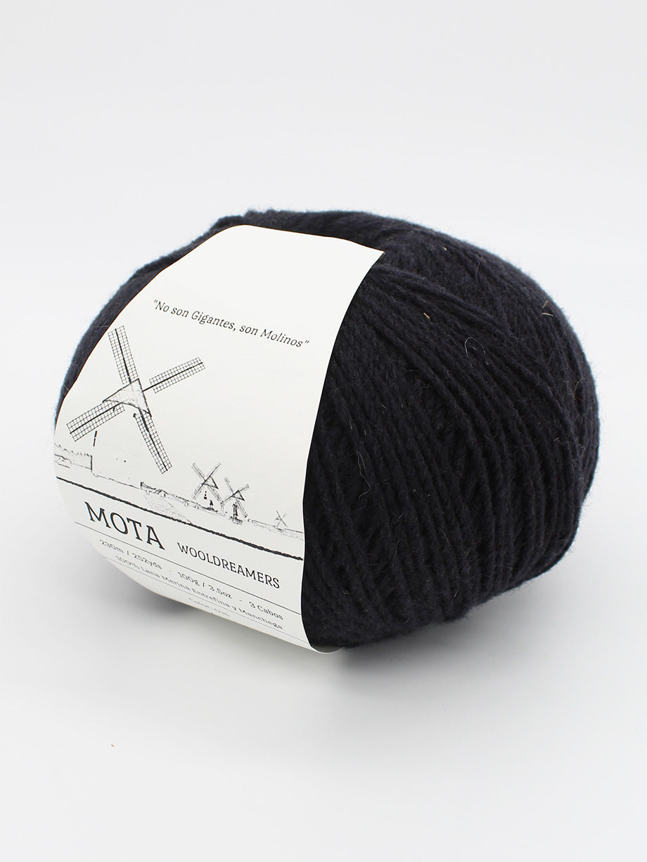 A skein of black yarn on a white background.