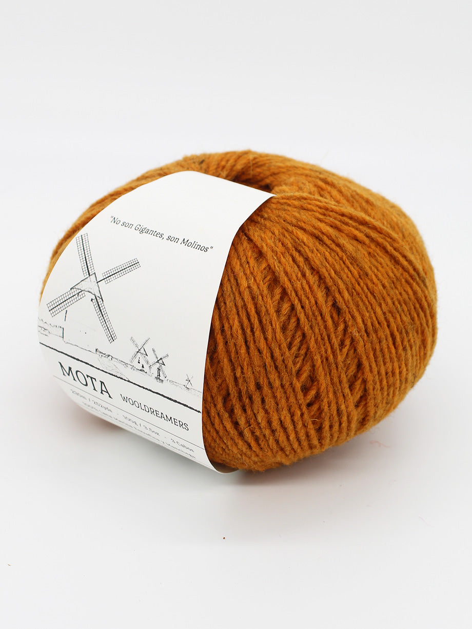 A skein heathered pumpkin orange yarn on a white background.