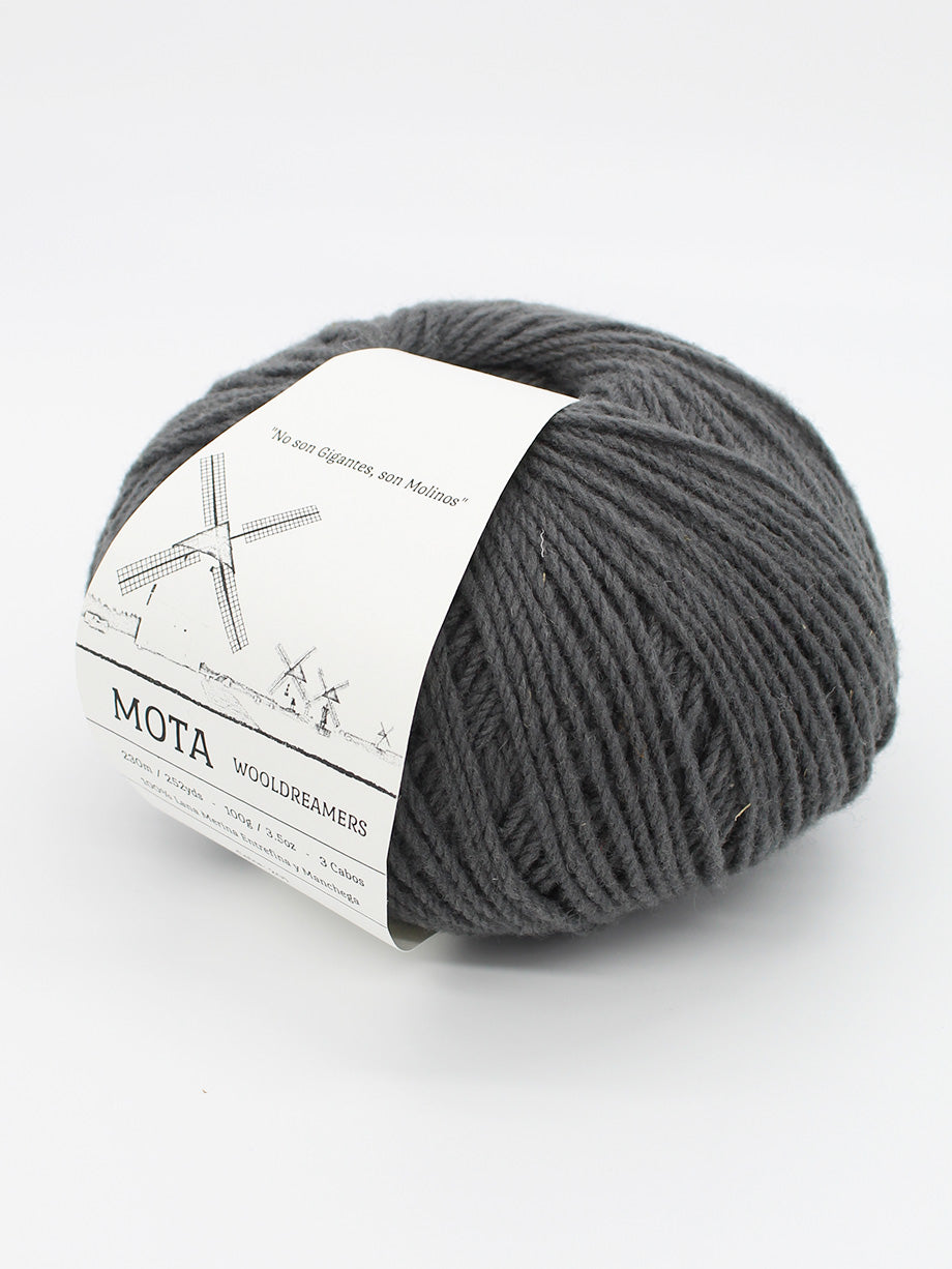 A skein of dark grey yarn on a white background.