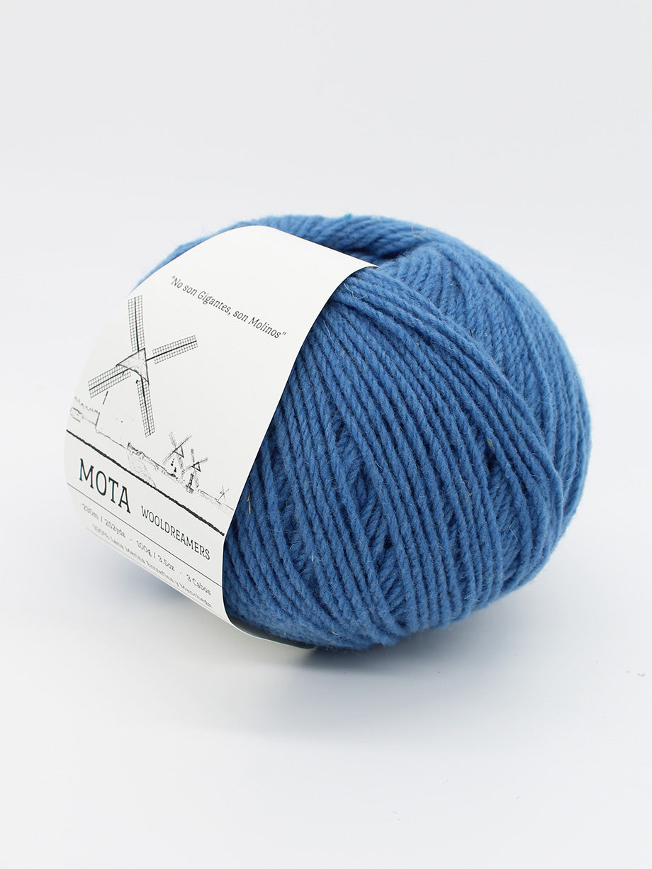 A skein of cerulean blue yarn on a white background. 
