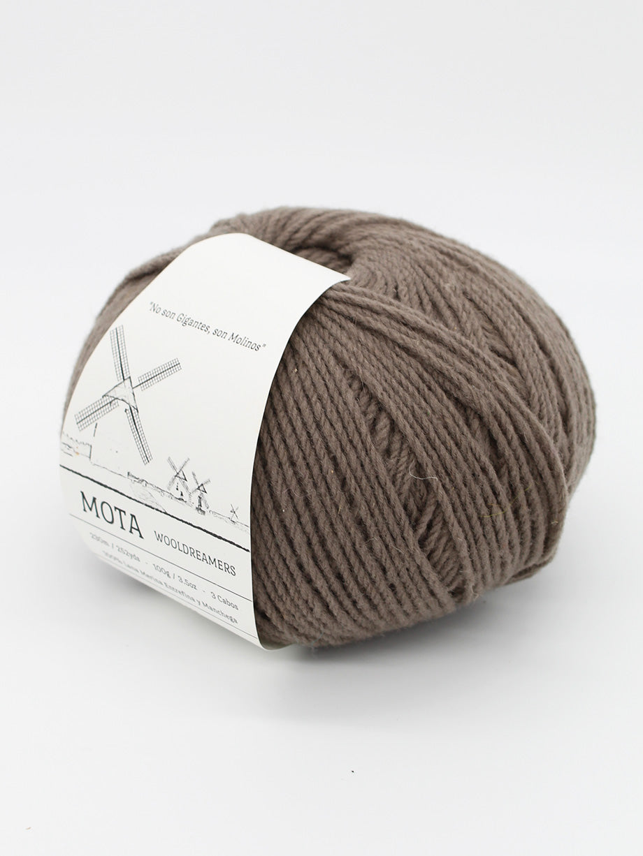 A skein of taupe brown yarn on a white background.