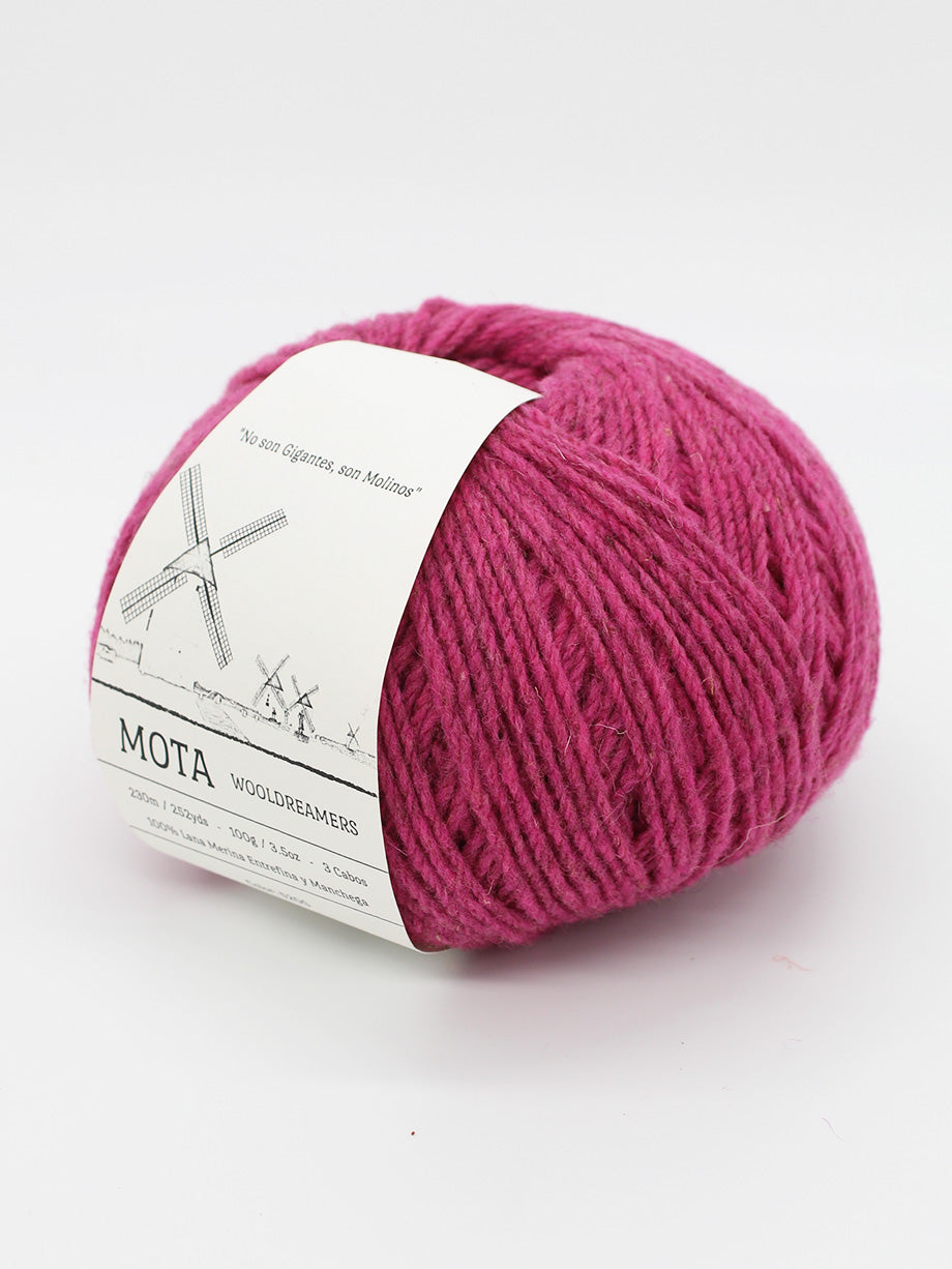 A skein of heathered fuscia yarn on a white background.