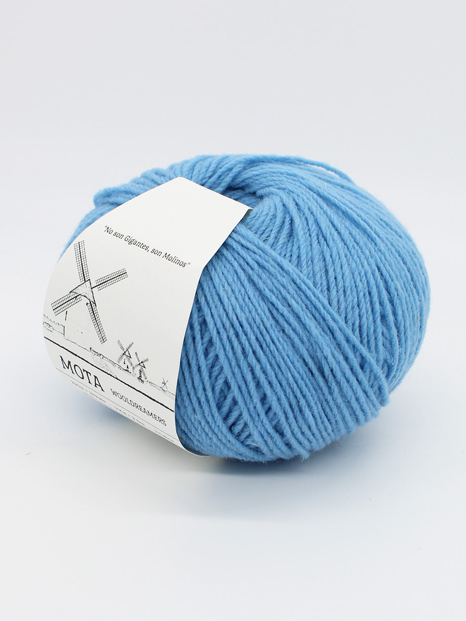 A skein of sky blue yarn on a white background.