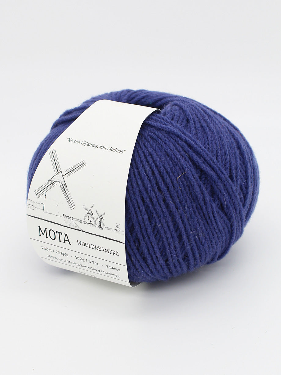 A skein navy blue yarn on a white background.