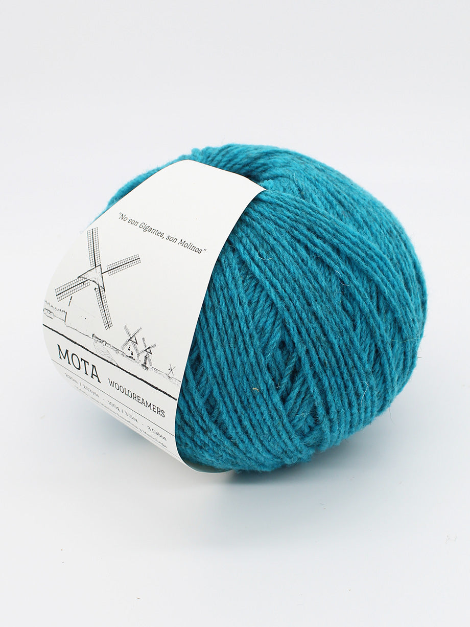 A skein of heathered teal yarn on a white background.