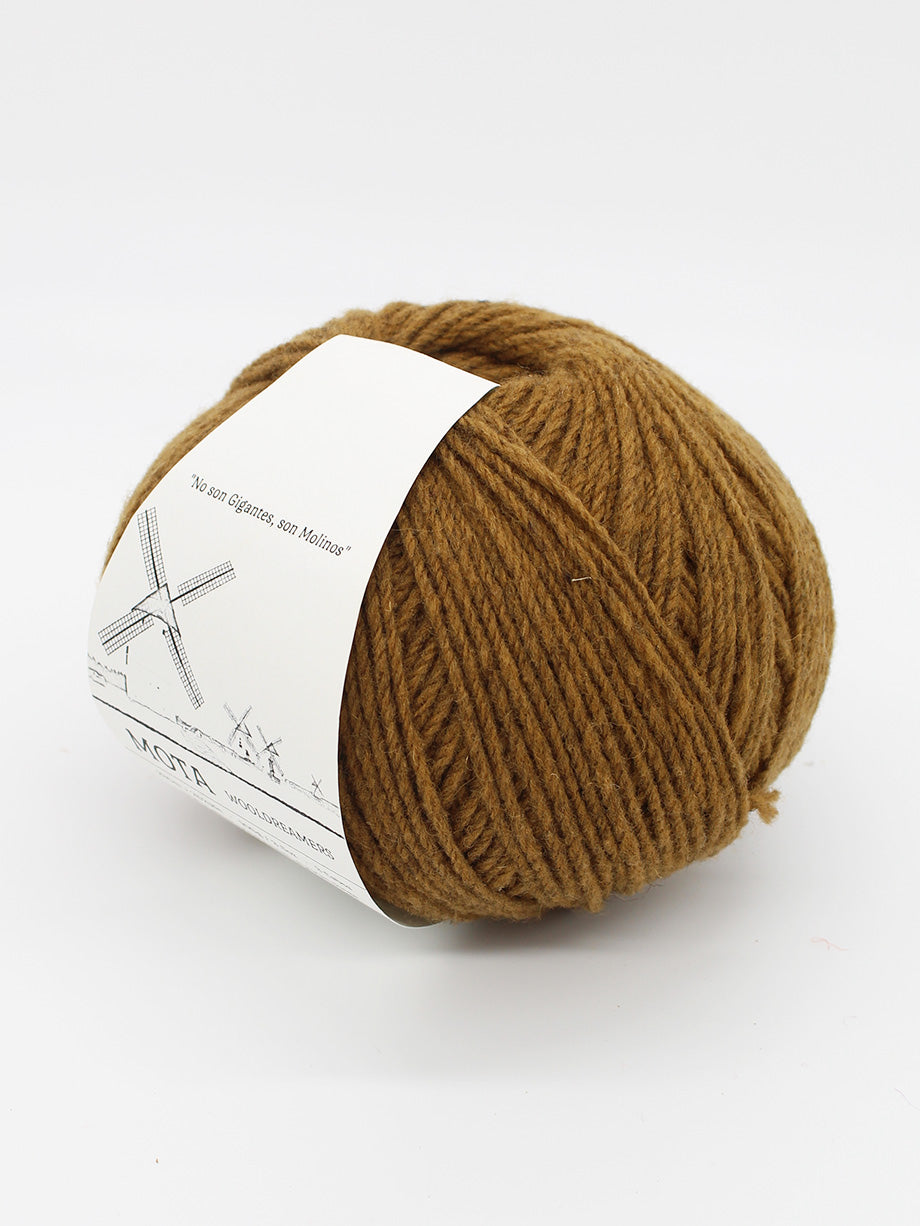 A skein of medium brown yarn on a white background.