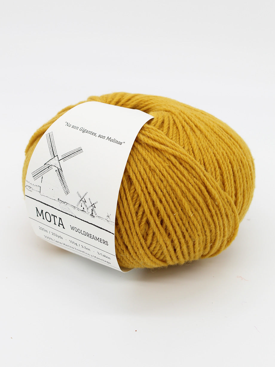 A skein of dandelion yellow yarn on a white background.